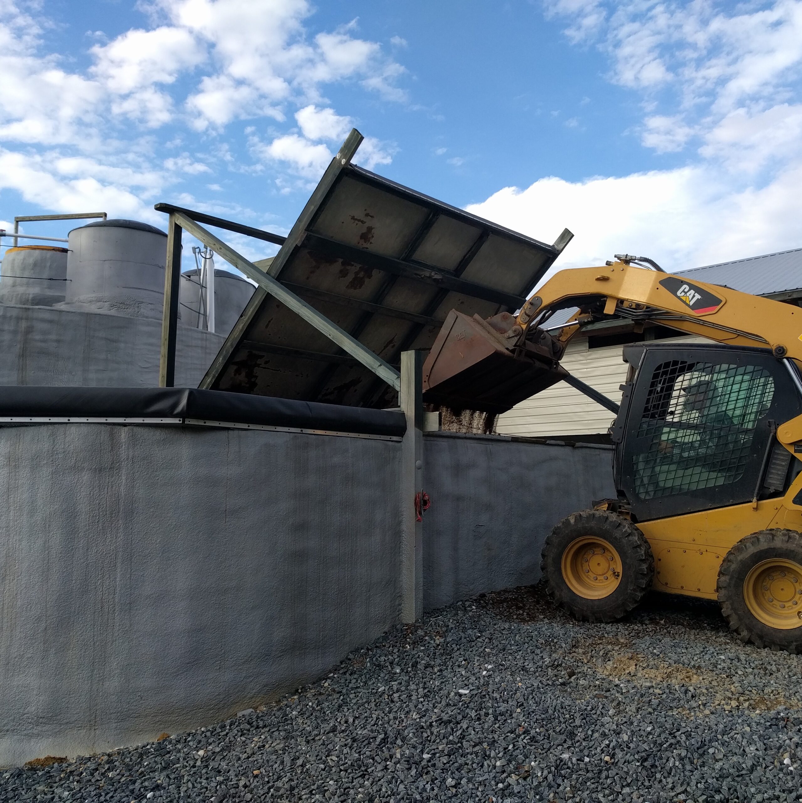 Poultry litter being fed into Planet Found's anaerobic digestion and nutrient recovery facility in Pocomoke City, MD